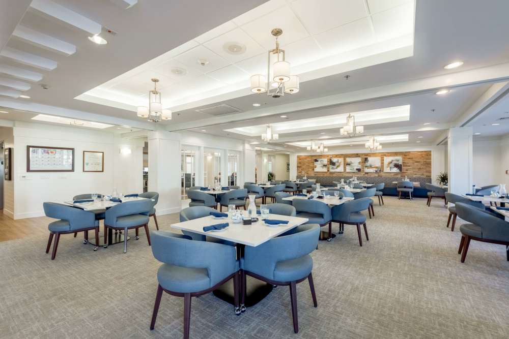 Modern dining area with blue chairs and tables