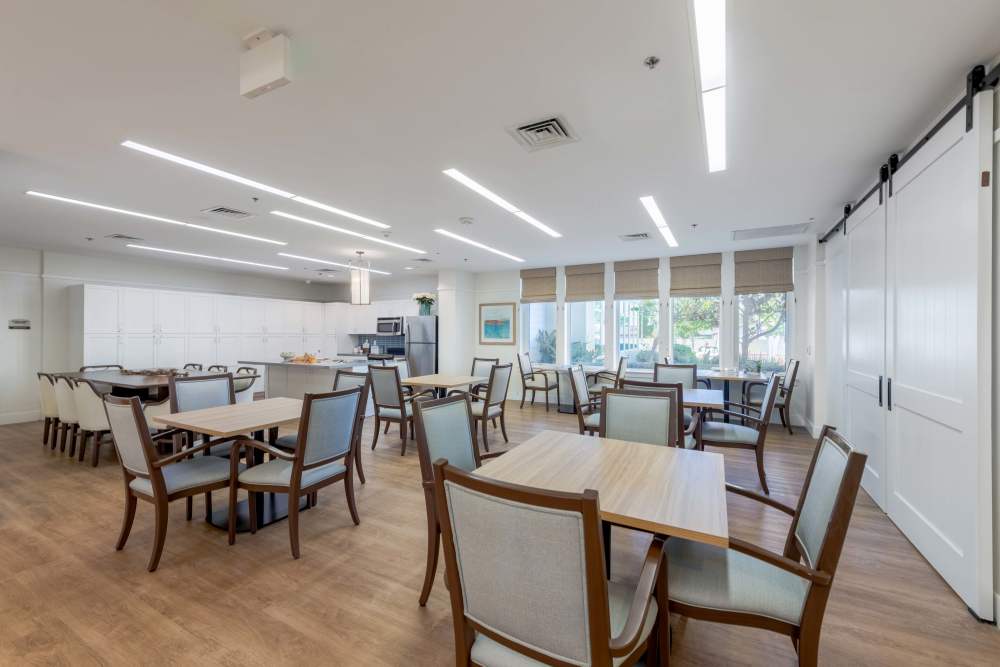 Bright common area with tables and chairs