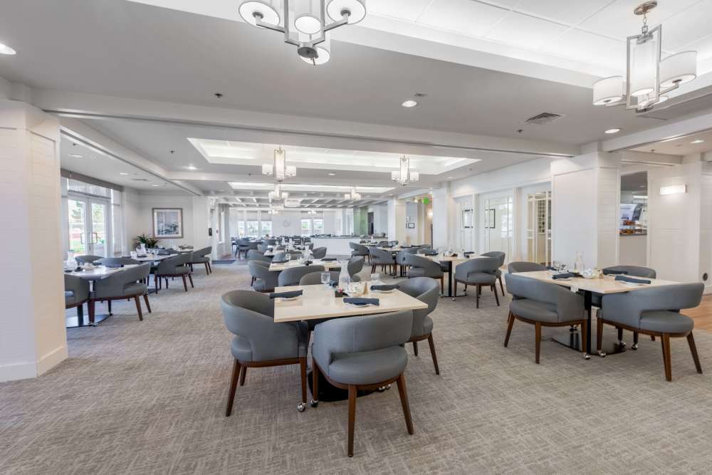 Bright dining room with tables set for meals