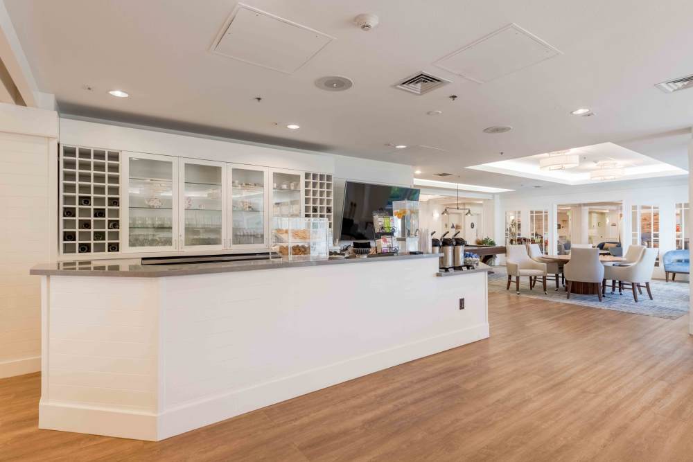 Bright common area with seating and service counter