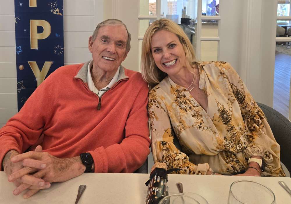 Residents enjoying a cheerful moment together at a table