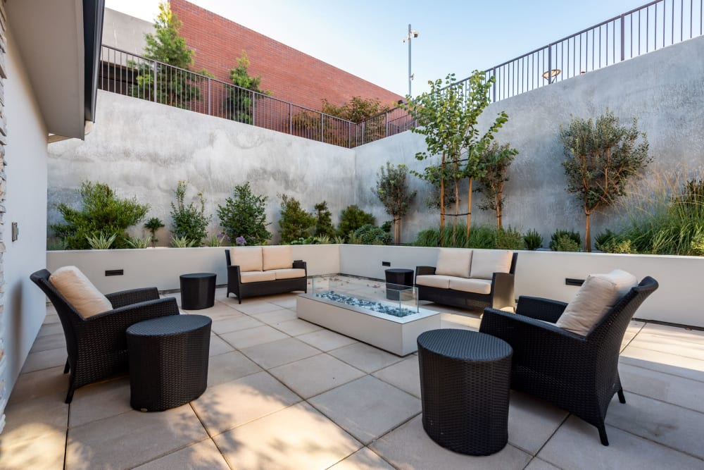 Outdoor seating area with plants and seating