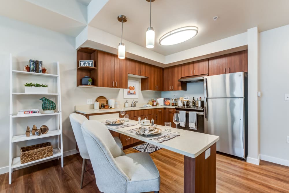 Modern kitchen interior with dining arrangement