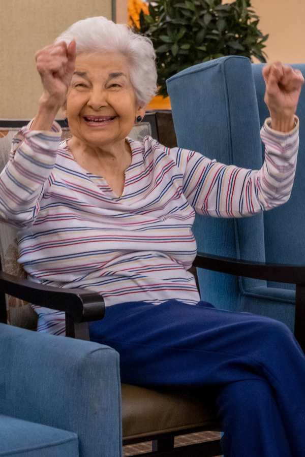 Resident celebrating in a bright common area