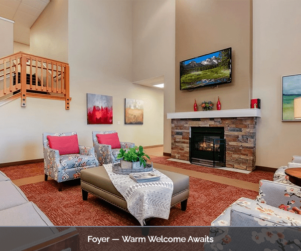 Cozy foyer with seating area and fireplace