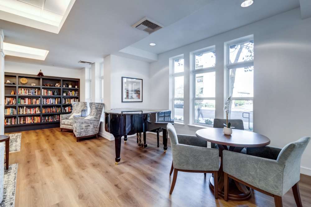Bright common area with bookshelves and seating