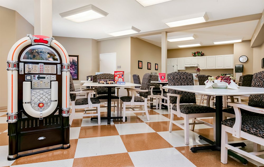 Bright common area with jukebox and tables