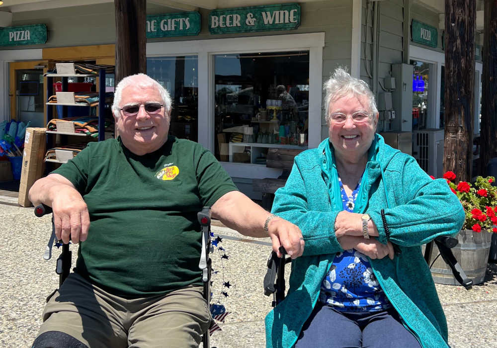 Two residents smiling in a vibrant outdoor setting