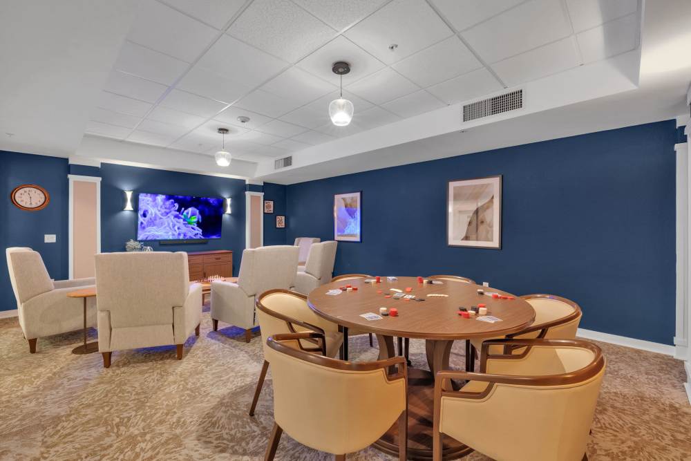 Common area with card tables and lounge seating