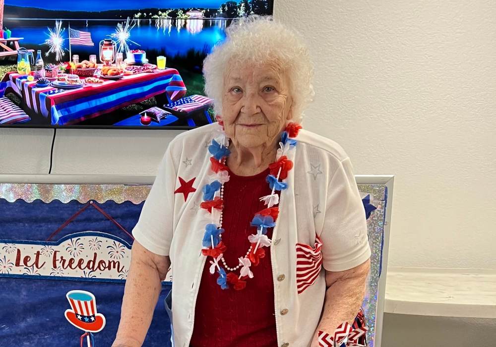 Resident celebrating at a festive event with decorations
