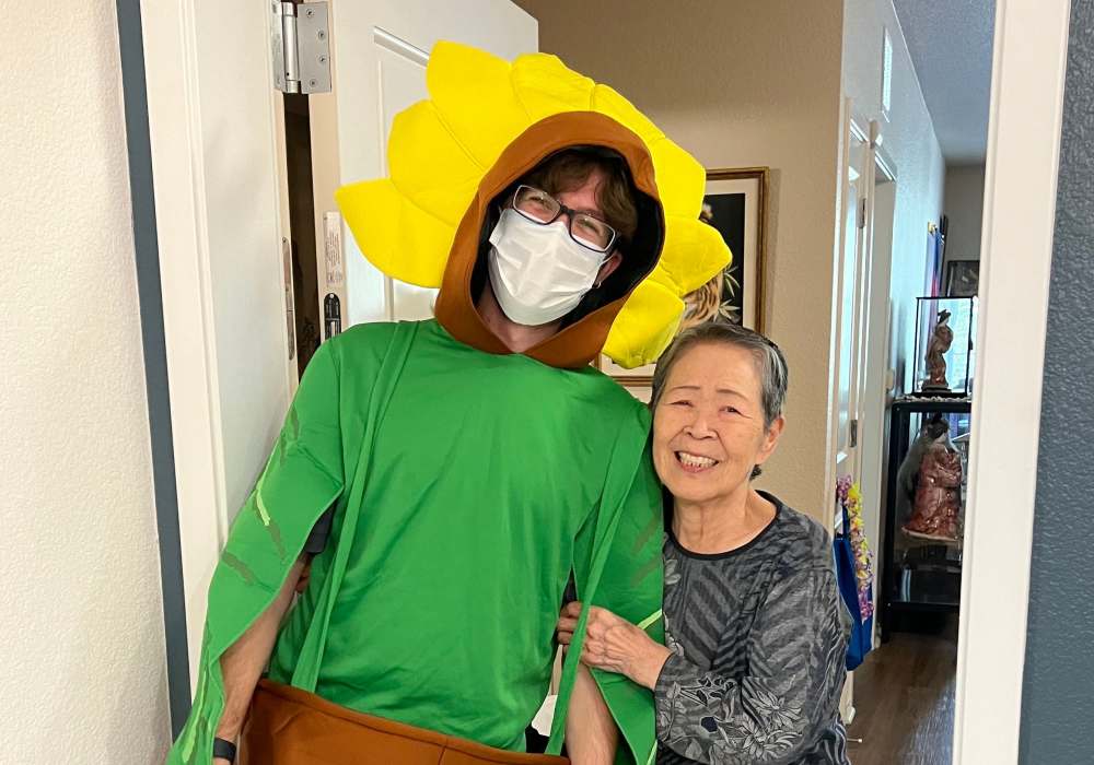 Staff member in costume with resident