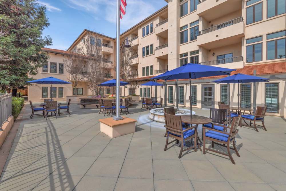Outdoor patio area with tables and umbrellas