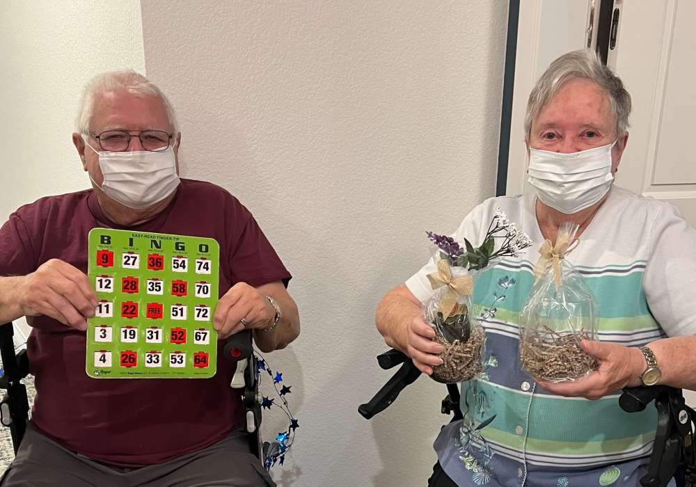 Residents enjoying bingo and crafts in a common area