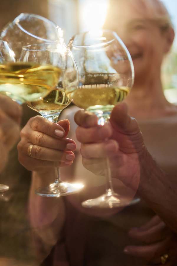 Residents toasting with wine glasses during a celebration