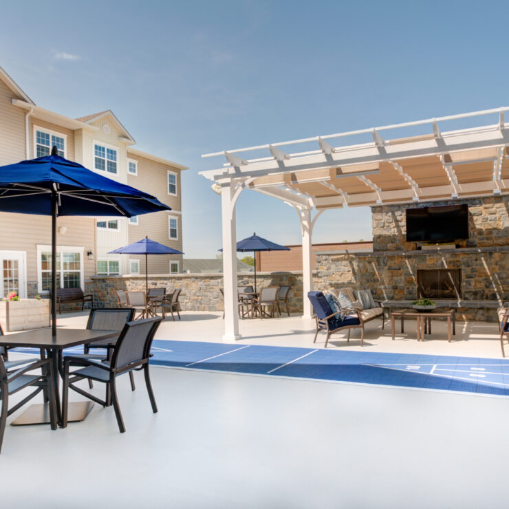 Outdoor patio area with seating and umbrellas