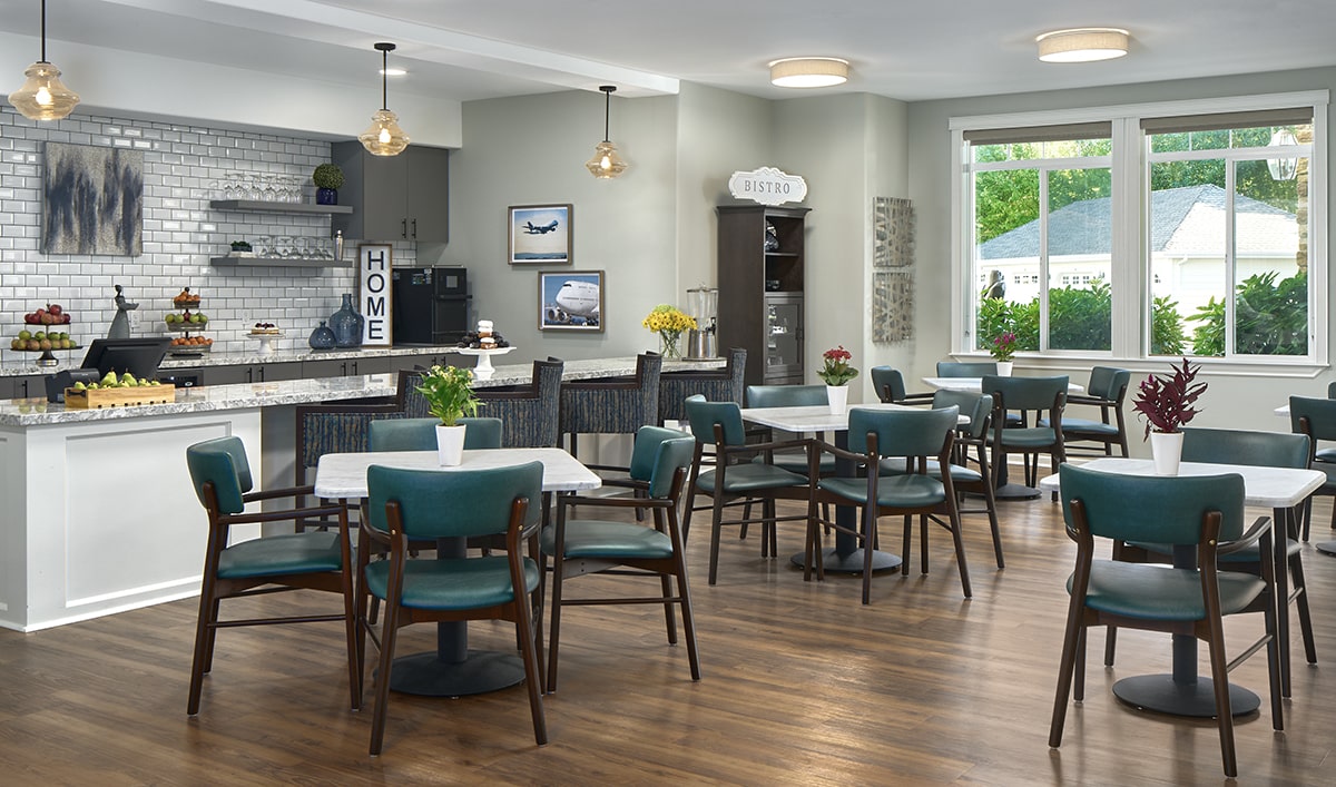 Bright dining room with tables and chairs