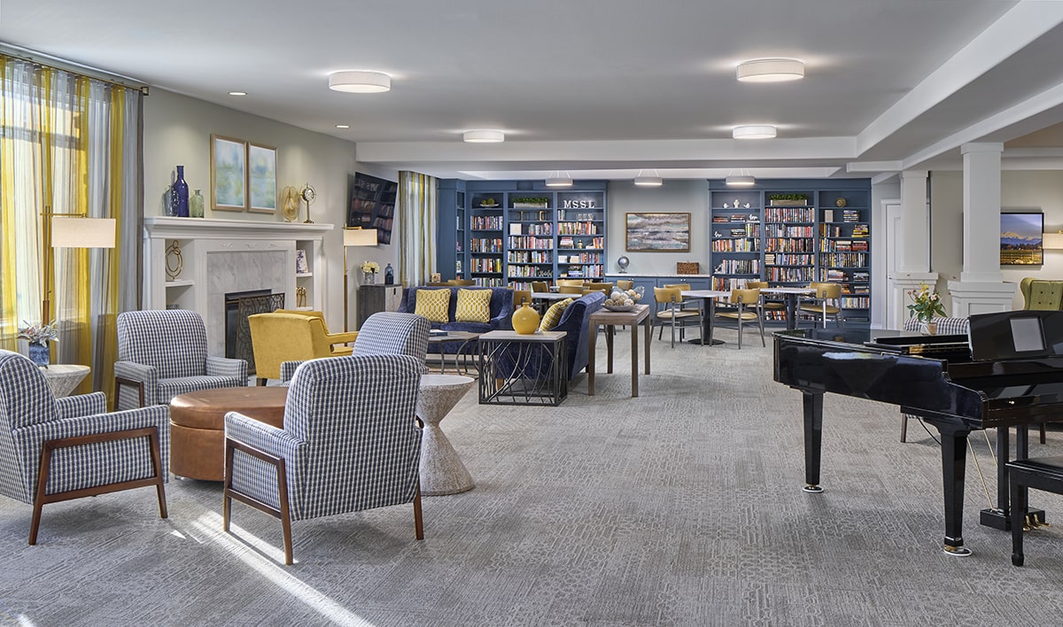 Bright common area with seating and bookshelves