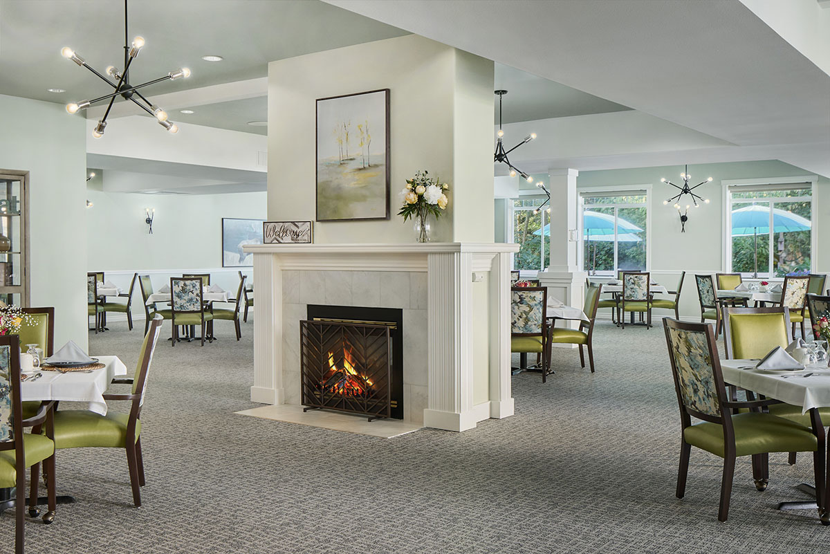 Interior dining area with fireplace and decorated tables