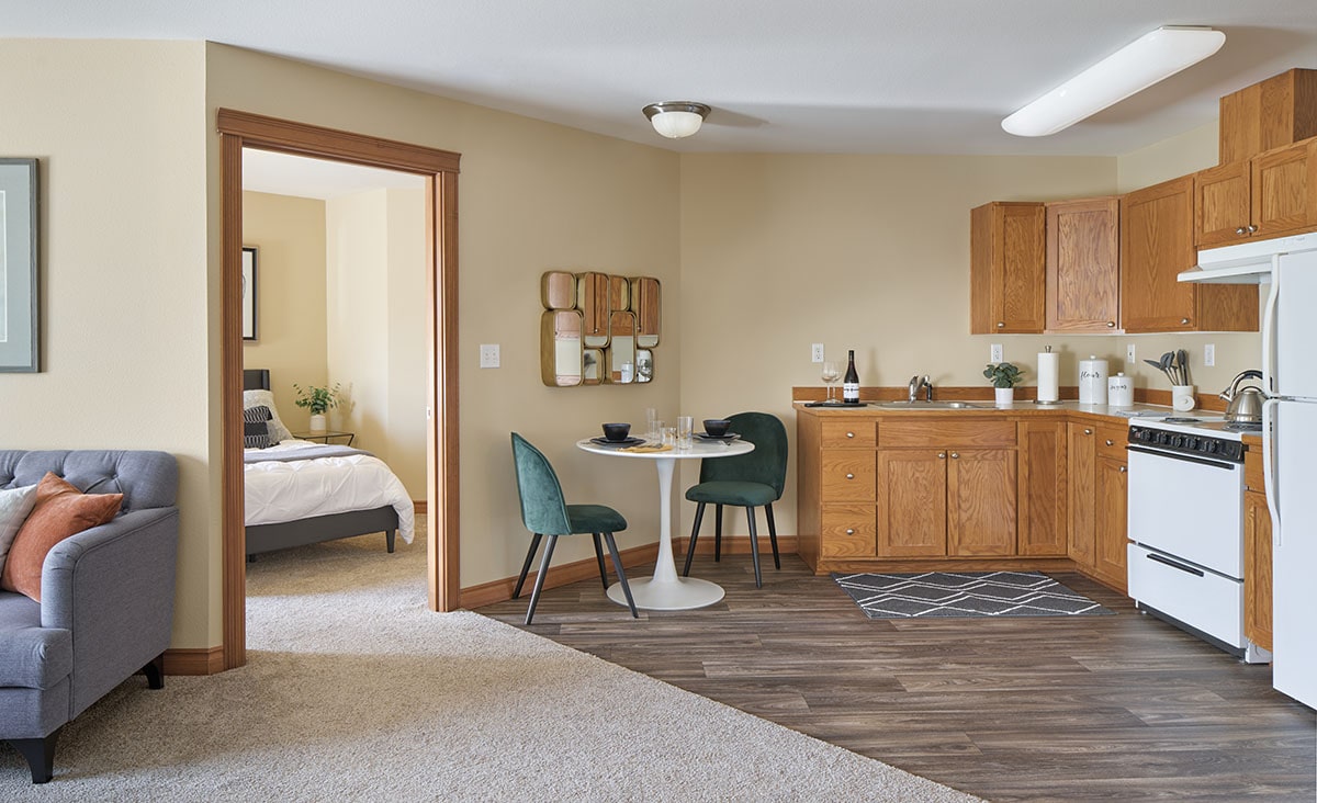 Cozy kitchenette and living area in a resident unit