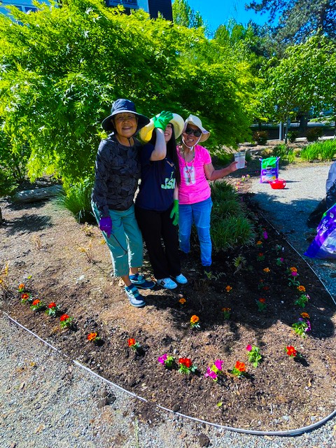 Residents gardening together in a vibrant outdoor space