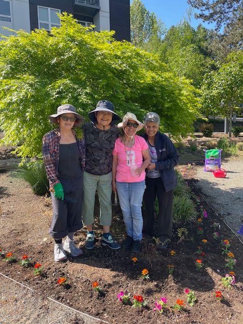 Residents participating in gardening activity outdoors