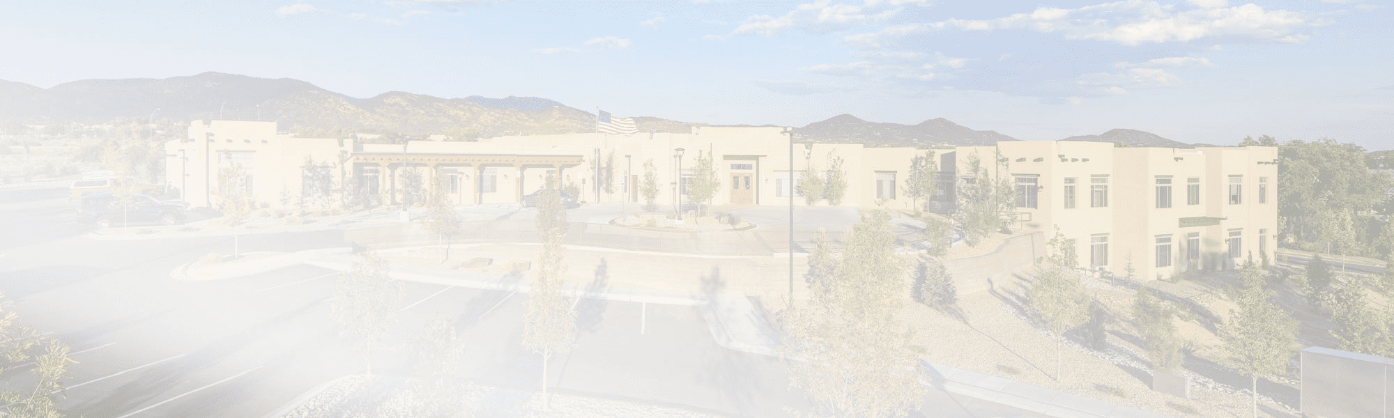 Exterior view of the assisted living facility with surrounding landscape