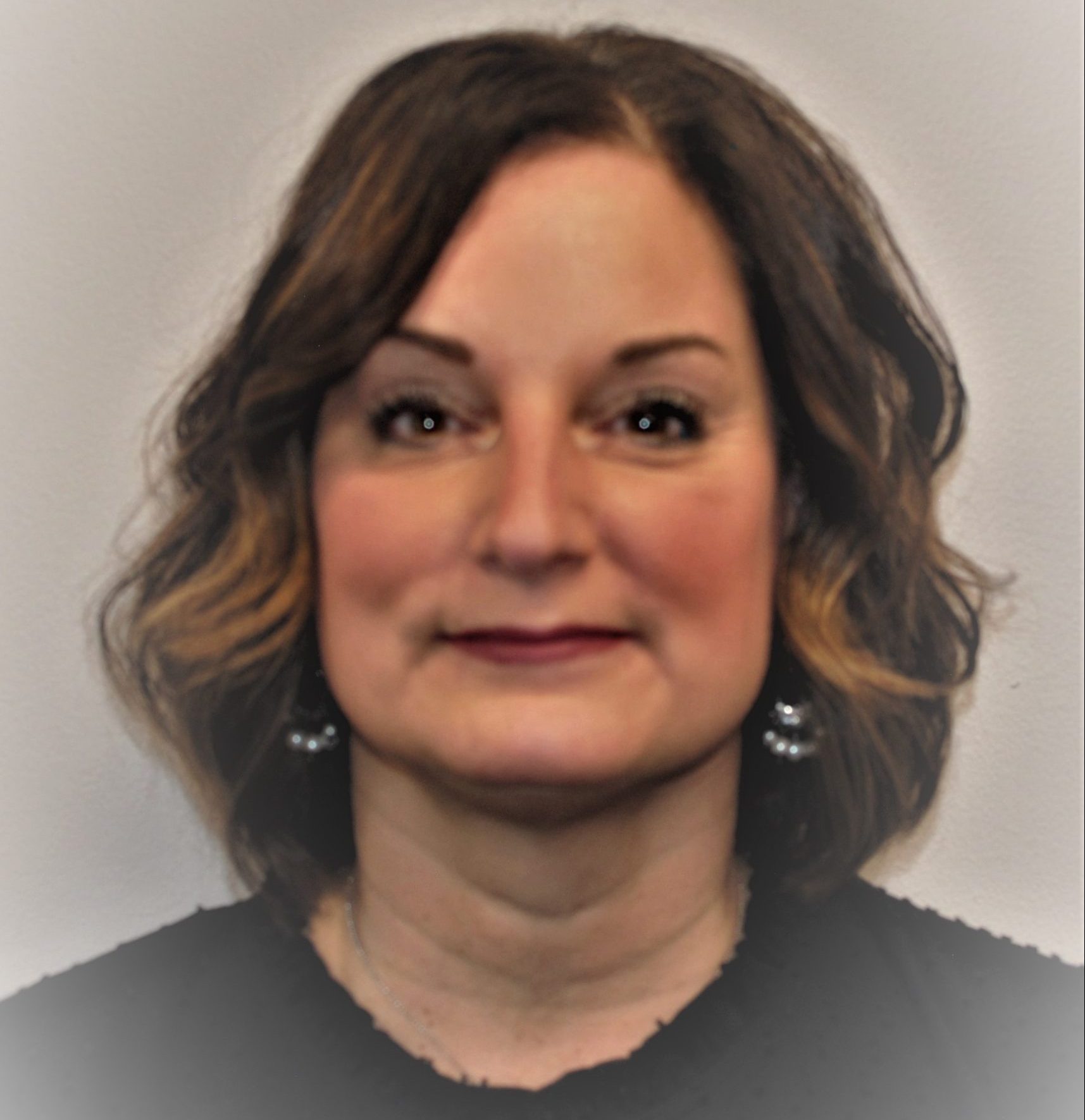 Headshot of a woman with medium-length hair