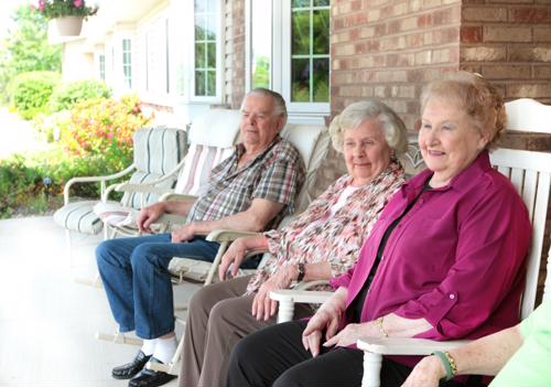 Residents enjoying time together on the porch