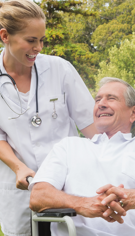 Nurse interacting with a smiling resident in a garden