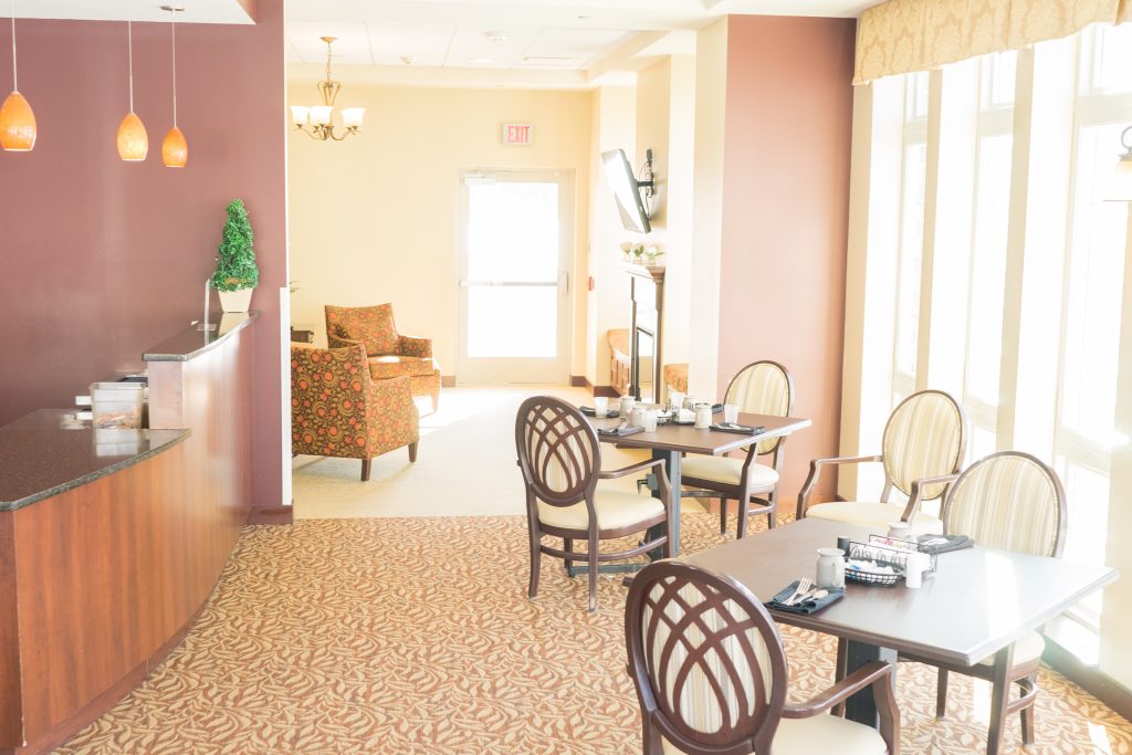 Bright dining area with tables and chairs