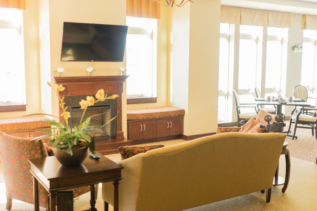 Comfortable lounge area with seating and a fireplace