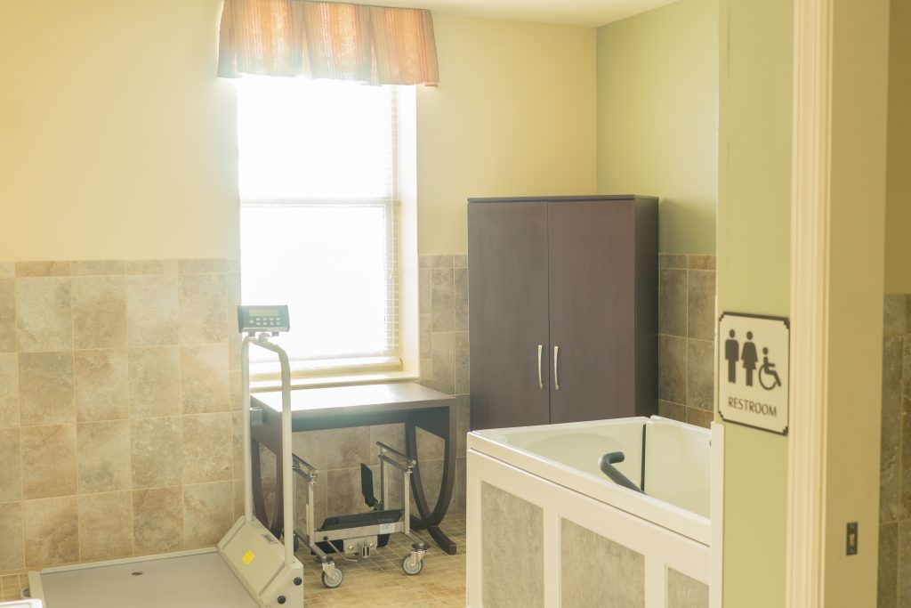 Interior view of a therapy room with a bathtub