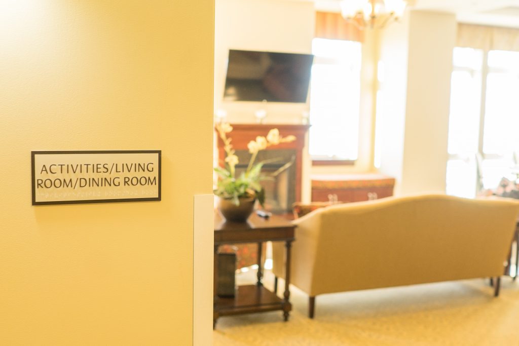 Sign for activities and dining room in a common space