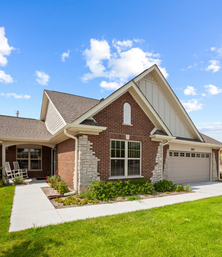 Exterior view of a residential facility with landscaped yard