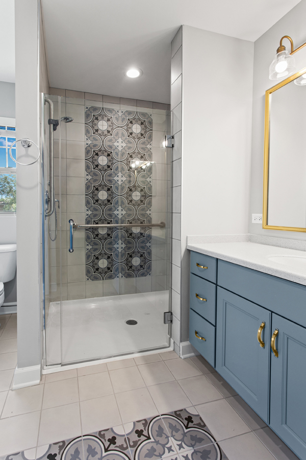 Modern bathroom with a walk-in shower and decorative tiles