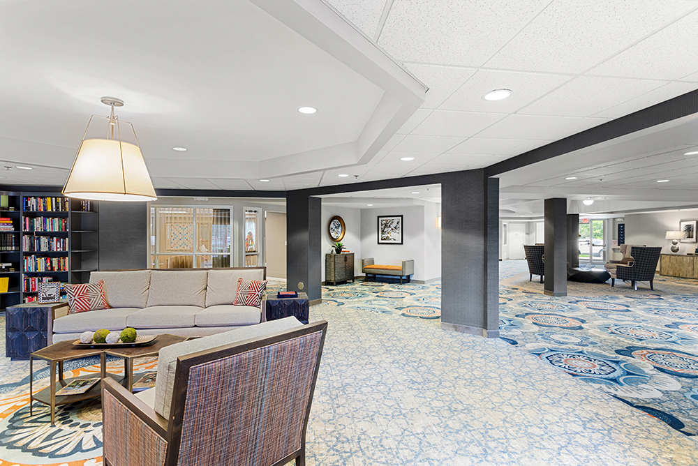 Interior common area with seating and bookshelves