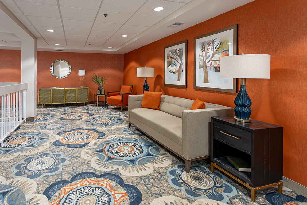 Bright common area with seating and decorative art