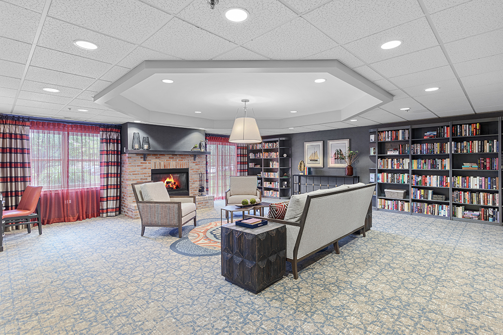 Interior common area with seating and bookshelves