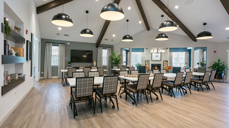 Bright common area with tables and chairs