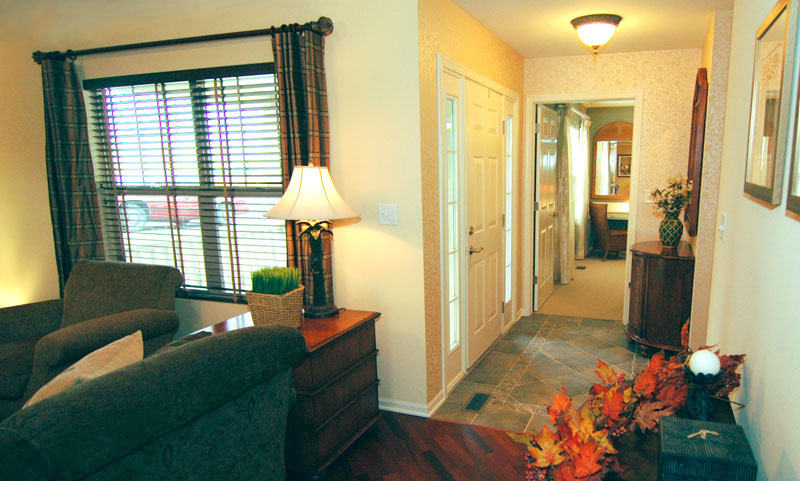 Interior view of a cozy hallway with a lamp