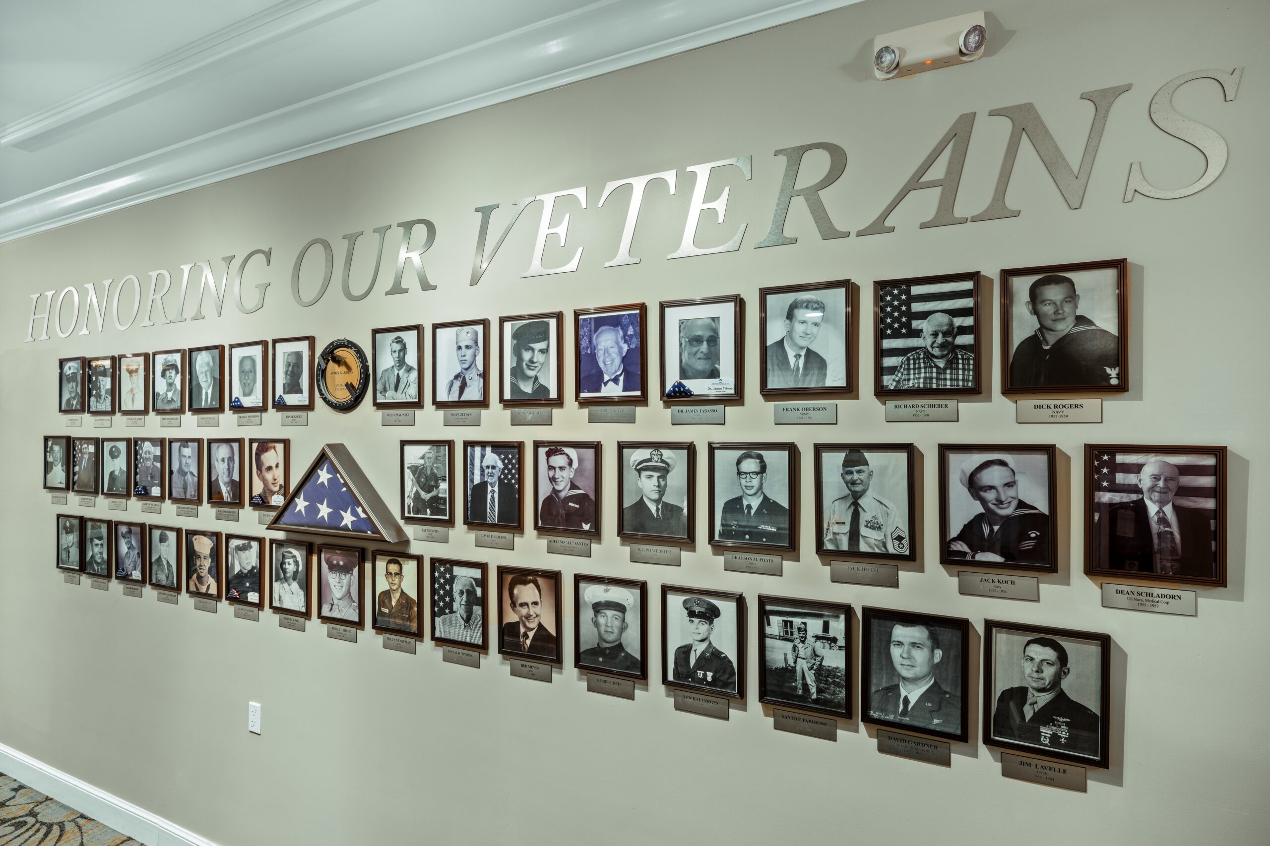 Wall dedicated to honoring veterans with framed photos