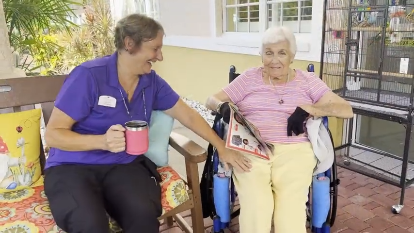 Staff and resident enjoying time outdoors together
