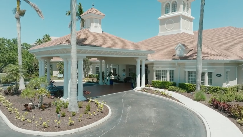 Exterior view of Aston Gardens at Pelican Pointe entrance