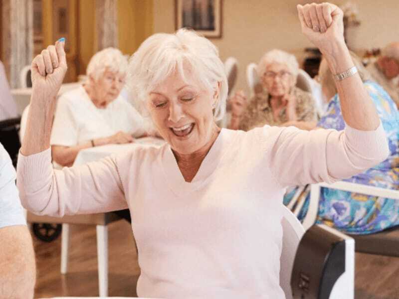 Residents engaged in a group activity with joy