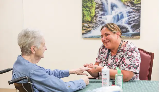 Staff member providing care to a resident