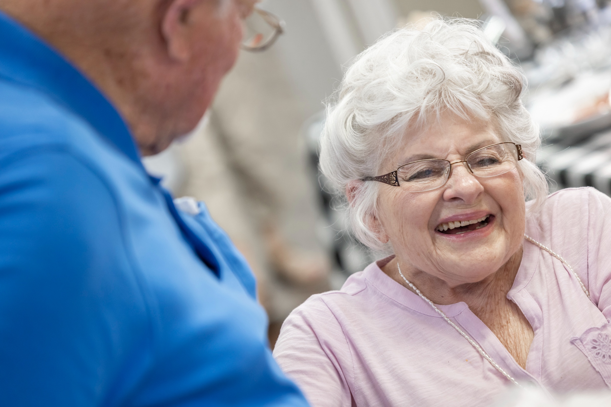 Resident smiling during a social interaction