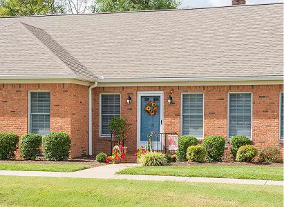 Exterior view of a residential-style facility with landscaping