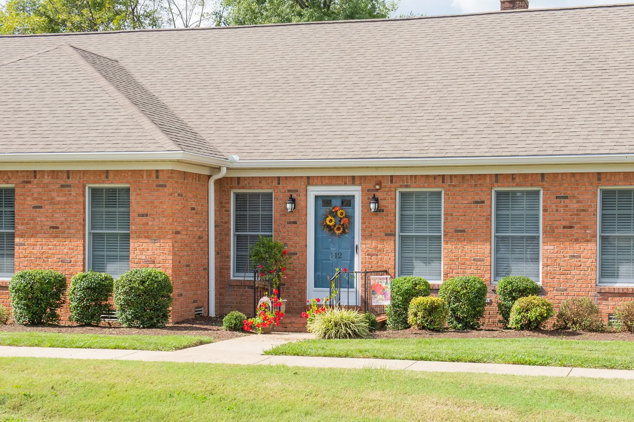 Exterior view of a residential building with landscaping