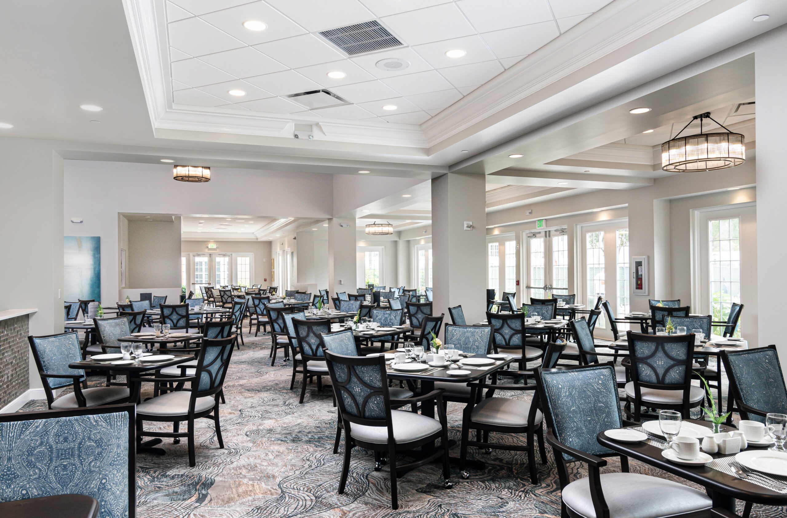 Bright dining room with neatly arranged tables and chairs