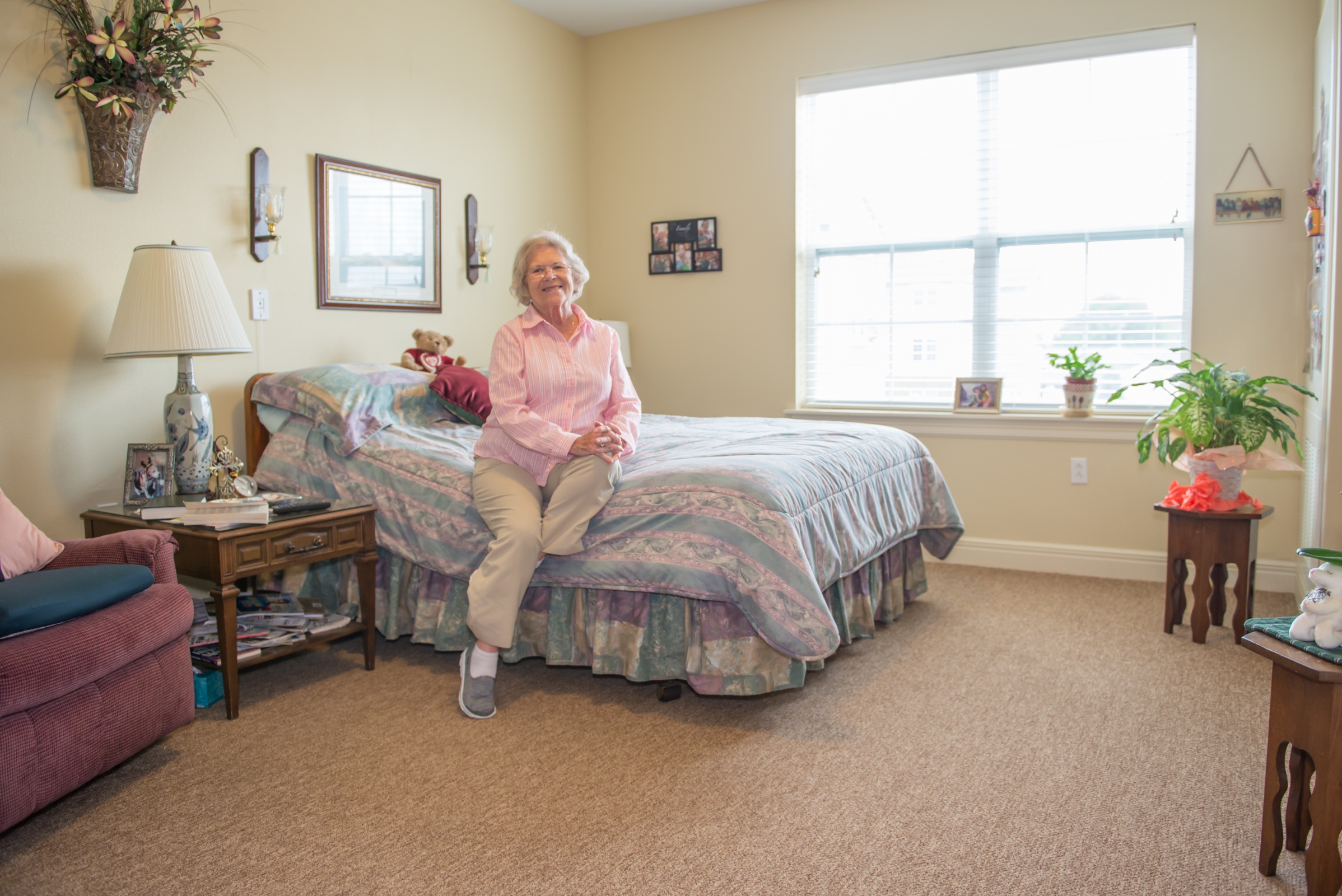 Resident enjoying her cozy private room